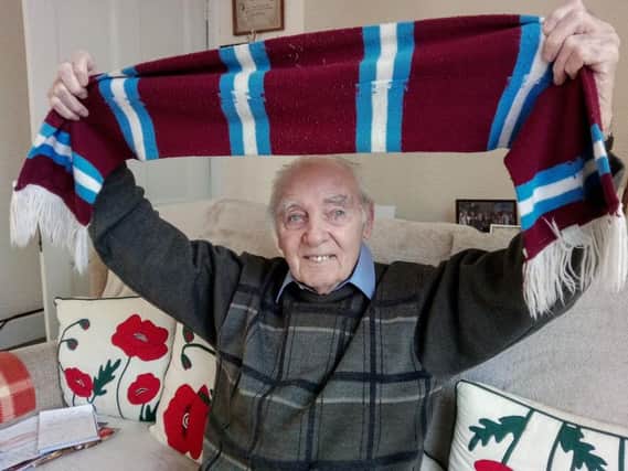 Pat Fleming at home with his Clarets scarf