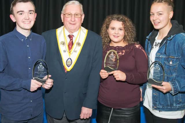Prizes winners (from left to right) Harry McManus,  Bethany Swaine and Naomi Hartley with Trevor Ireland, Grand Knight from the Knights of St Columbia, who sponsored one of the awards.