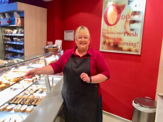 Karen behind the counter at Oddie's where she has worked for the past 25 years