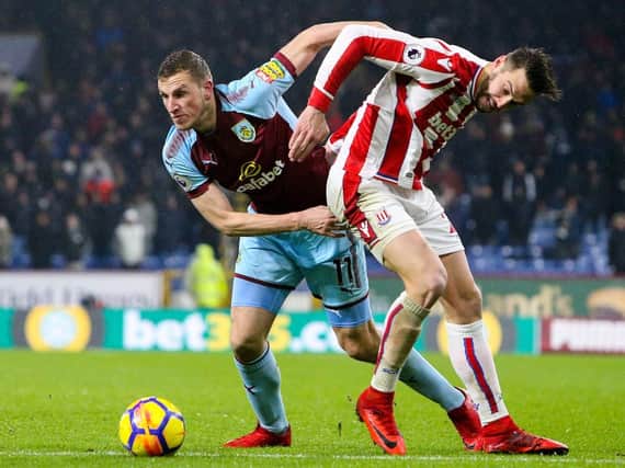 Chris Wood battles with Stoke City's Geoff Cameron