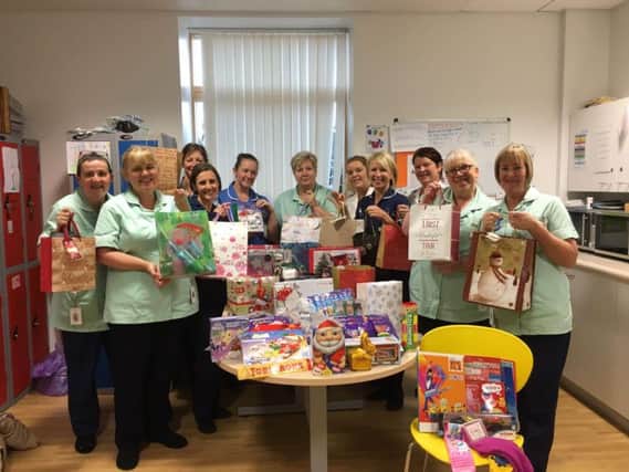 The Gynaecology Outpatients Department at the Lancashire Women and Newborn Centre with their donations for the Women's Refuge.