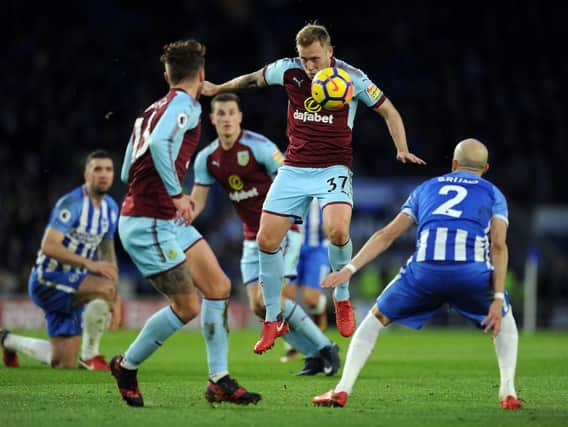 Scott Arfield attempts to control the ball
