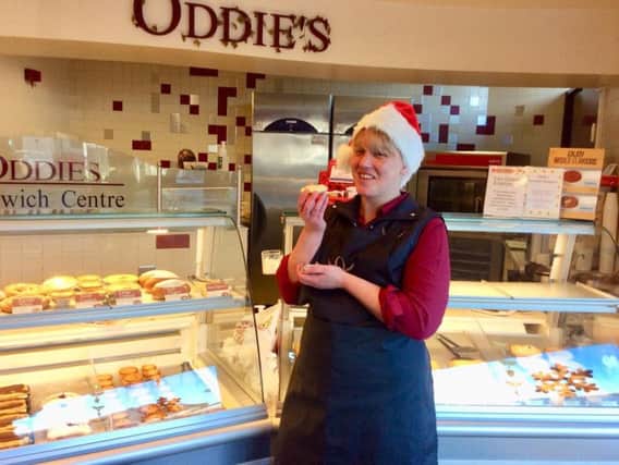 Sales assistant Anne Marie Heseltine samples one of the mince pies at Oddie's shop in Scotland Road, Nelson.