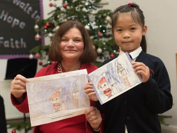MP Julie Cooper with Grace Huang (seven) the winner of her Christmas card competition.