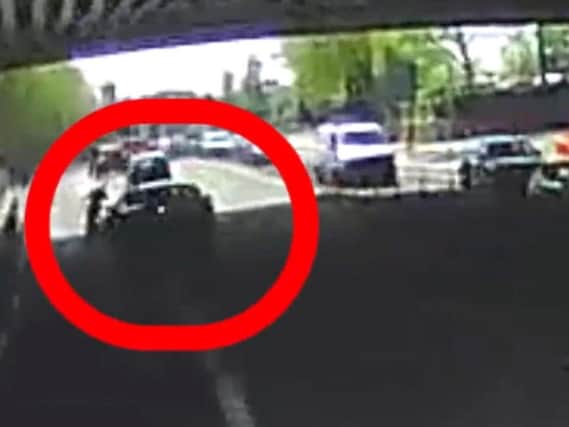 Still from handout video issued by Essex Police of Ashley Merrett swerving his Ford Mondeo into a cyclist