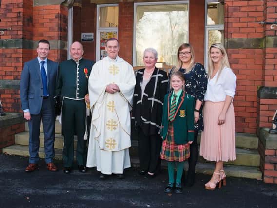 Mr Baron (second from left) after being awarded with the papal knighthood with (from left to right) his son Leo, the Bishop of Salford, his wife Jean, his daughters Katrina and Gemma  and his granddaughter Isabelle.