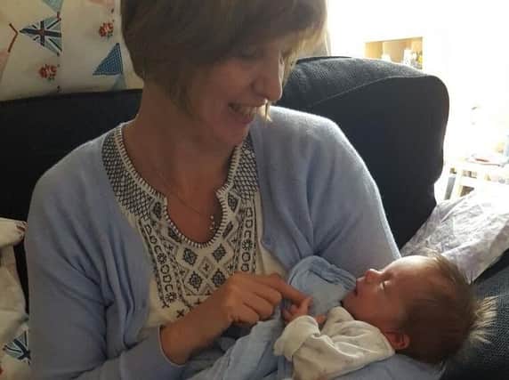 Jeanne Cookson with grandson, baby George. (s)