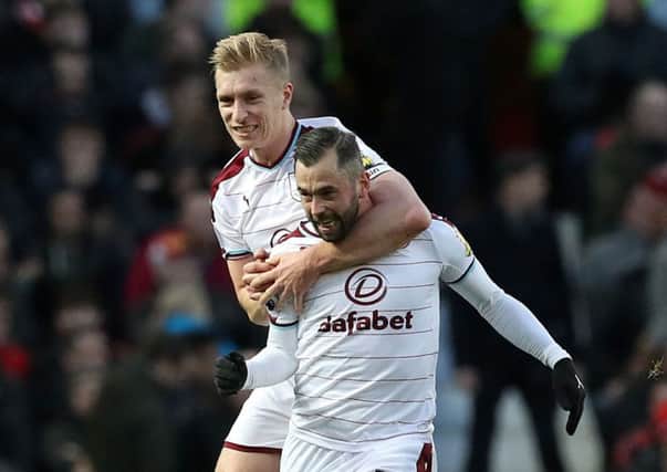 Burnley's Steven Defour (16) celebrates scoring his side's second goal, with team-mate Ben Mee during the Premier League match at Old Trafford, Manchester. PRESS ASSOCIATION Photo. Picture date: Tuesday December 26, 2017. See PA story SOCCER Man Utd. Photo credit should read: Martin Rickett/PA Wire. RESTRICTIONS: EDITORIAL USE ONLY No use with unauthorised audio, video, data, fixture lists, club/league logos or "live" services. Online in-match use limited to 75 images, no video emulation. No use in betting, games or single club/league/player publications.