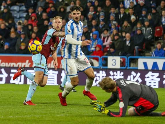 Huddersfield keeper Lossl denied Scott Arfield a goal at his former club