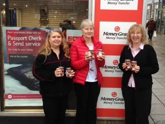 Donna Lowe and Anne Villiers of Nelson Post Office, and Lynne Mitchell (centre) of the Pendle Foodbank