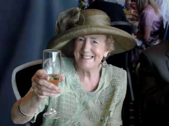 Gladys Whitaker, who spent several years working as the childcare and adoptions officer in Burnley, toasts her 80th birthday at York Races.