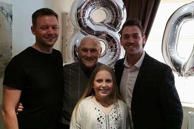 Dennis with his grandchildren Mark Hindle, Josh Hindle, and Kira Royle. (s)