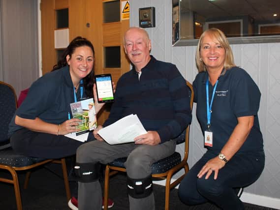 Pendle staff Diane Lloyd and Cathy Bolton with social club member Peter