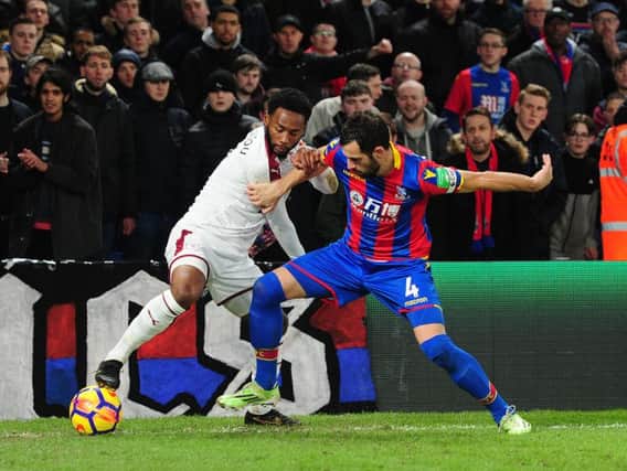 Burnley's Georges-Kevin Nkoudou battles with Crystal Palace's Luka Milivojevic