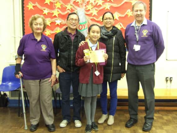 The Burnley Lions Poster of Peace competition winner Alessandra Dimalaluan  with her proud parents and Lions Jacquie Devlin and Frank Seed.