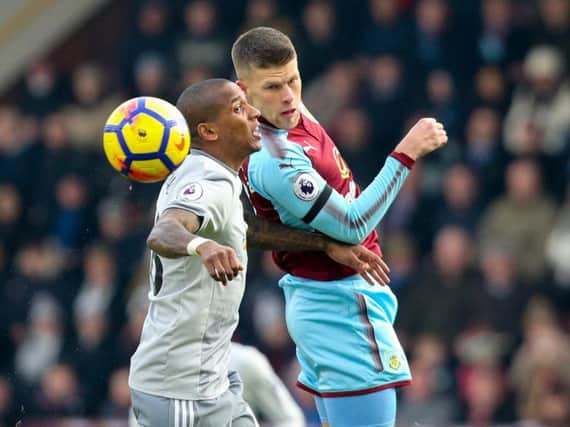 Johann Berg Gudmundsson challenges Ashley Young for the ball