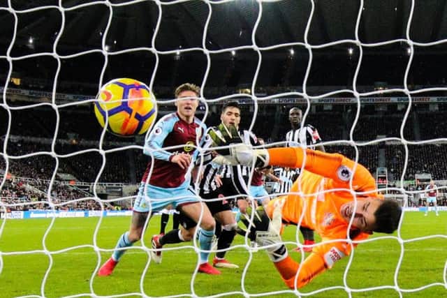 Newcastle keeper Karl Darlow can't prevent Sam Vokes' header from eventually going in off the back of his head