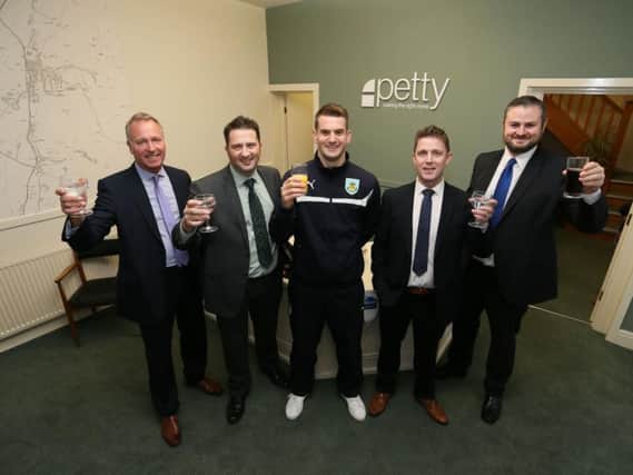 Burnley Football Club goalkeeper, Tom Heaton (centre), with directors (from left) Brent Forbes, Ian Bythell, and Simon Morgan, with Pendle MP, Andrew Stephenson (far right), at the opening of the new office of Petty's Estate agents in Barnoldswick.