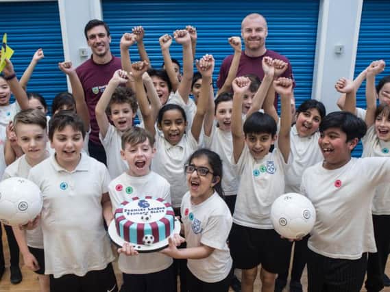 Dyche and Cork join pupils of St Peter's CE Primary School in Burnley