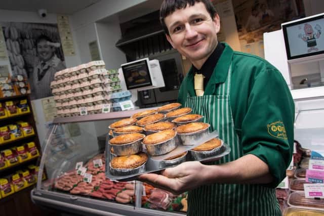Butcher Daniel Heys with the famous pies, named in the top five in Lancashire by the Lancashire Pork Pie Appreciation Society.