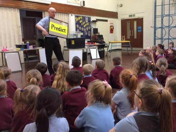 A science lesson at Holy Trinity Primary School in Burnley has these students hooked
