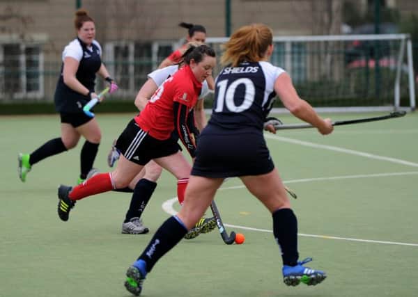 Pendle Forest Hockey Club (red) v Lytham Hockey Club at Marsden Heights Community School, Nelson. Lisa Crewe in action. Picture by Paul Heyes, Saturday March 12, 2016.