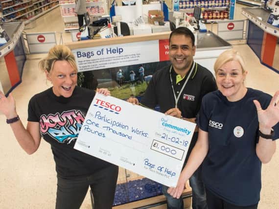 Pictured celebrating with their cheque for 1,000 are (from left to right) Lynne Blackburn, Project Manager and Director Participation Works North West, Abdul Haleem, Director of Participation works and Billie-Jean Horne who is the Tesco Community Champion.