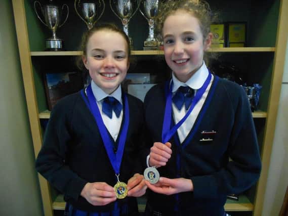 The victorious Annie and Amelia with their gold and silver medals.