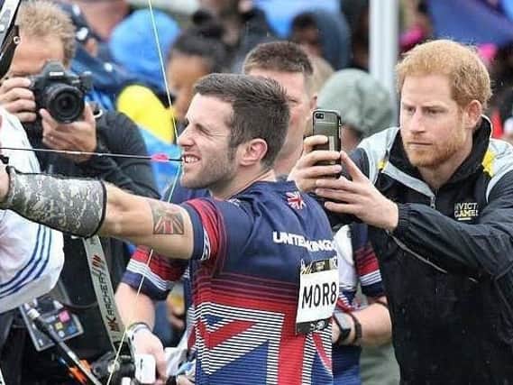 Prince Harry putting  Kieran in the picture at the Invictus Games in Toronto, 2017