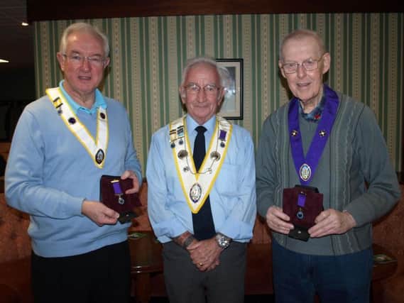 (From left) Knights of St Columba members Terry Hephrun, Peter Greenhalgh (Council 110 Grand Knight), and Gerald Perry.