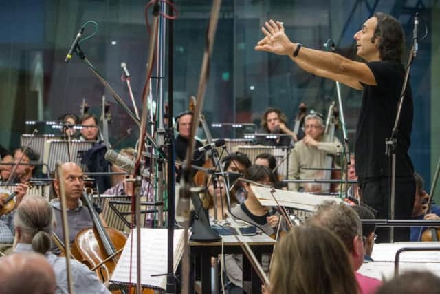 Alexandre Desplat, who won the Oscar for the score for 'The Shape of Water' conducting in Abbey Road Studio One (s)