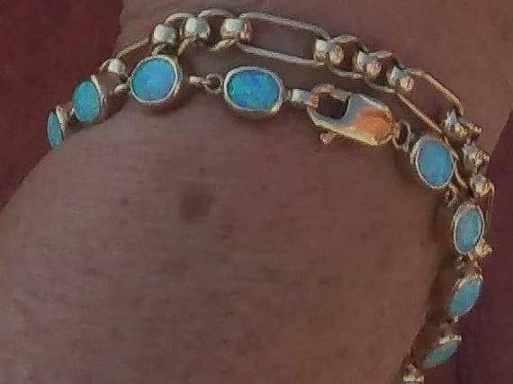 The bracelet with opal stone detail that was stolen.