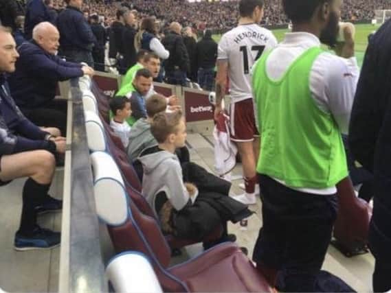 The boys on the bench with the Burnley players
