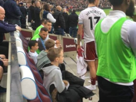 West Ham supporters in the Burnley dugout