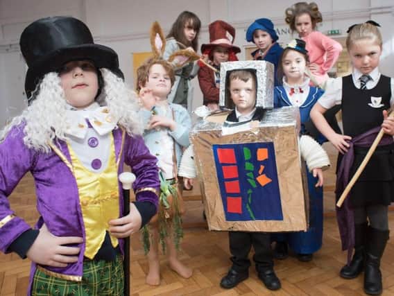 Willy Wonka, aka as Louis Woods takes charge of a  selection of characters during the World Book Day event at St Augustine's RC Primary School in Burnley.