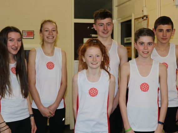The young Clayton Harriers, who are (left to right) Briony Holt, Ella Dorrington, Helana White, Josh Hall, Robbie Smedley with their Lancashire teammate Jack Villiers Trawden AC.