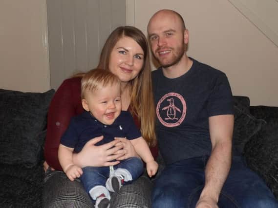 Little battler Harry with his parents,Stephanie George and Lee Murdoch