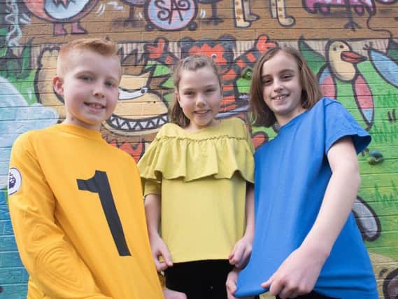 Joshua Glass, Sophie McGuigan and Eleanor Bottomley will be wearing Colours for Peace at St Augustine's RC Primary School in Burnley next week.