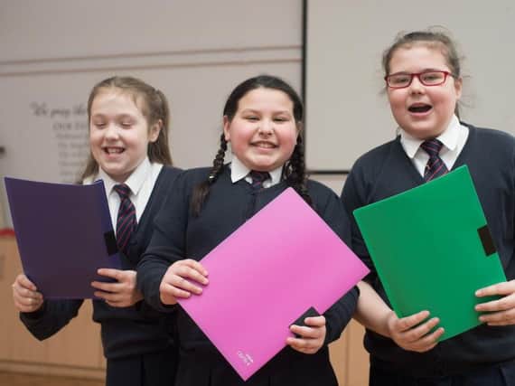Nadia Sattar, Hanna Jones and Mia Hope were among those from St Augustine;s RC Choir performing at the Sing Together event at King George's Hall in Blackburn.
