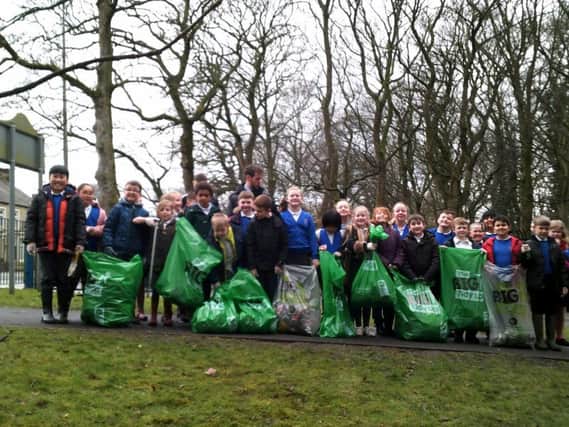 Hard working youngsters from Padiham Primary School after their litter pick in woods next to their school.