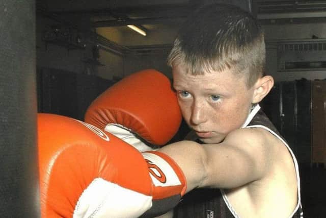 A young Shayne Singleton hits the bag at Sandygate ABC