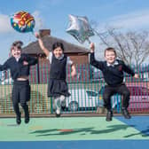 Leah Carrington, Jasmine Majed and Rory Wilcock  are jumping for joy the the good Ofsted report their school, St Augustine's RC Primary in Burnley, has received.