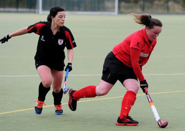 Pendle Forest 2nd (red) v Leyland and Chorley 1st (black), Ladies Hockey at Marsden Heights College, Nelson. Hayley Baines in action for Pendle Forest. Picture by Paul Heyes, Saturday October 31, 2015.