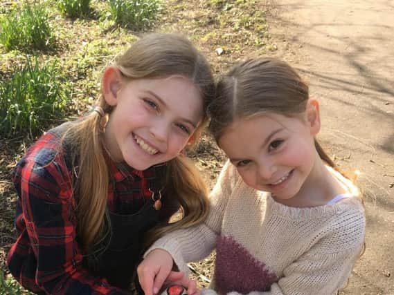 Abby and Amelia Knight are donating their locks to children who have lost theirs. (s)
