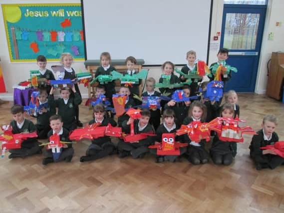 The children at St Joseph's RC Primary with their home made dragons.