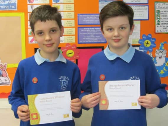 Maths champs Harry Anderton and Thomas H with their certificates