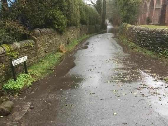Broad Lane was flooded following heavy rain PIC: Peter Duckworth