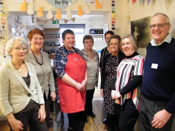 Carol Kerr, proprietor of The Scarlett Tearoom with her helpers and David Smith, Chair of Burnley Twinning with some of their members.