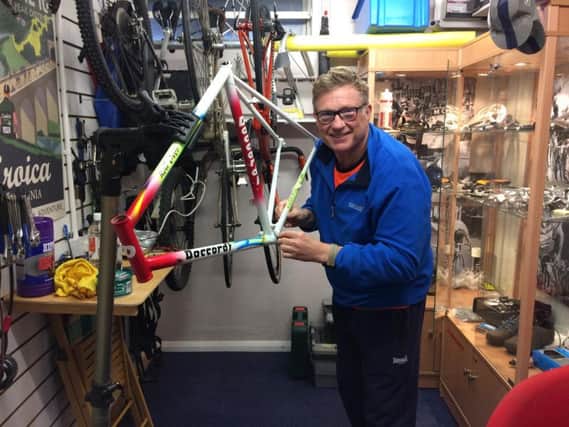 Sean Kirkwood works on a classic bike frame at his new business in Colne. (s)