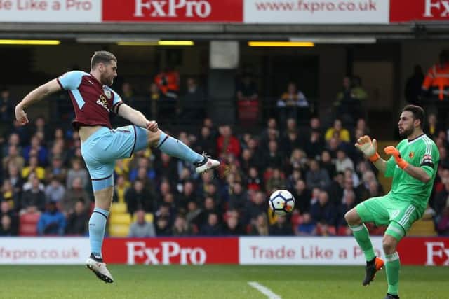 Sam Vokes volleys the Clarets level with his first touch after coming on as a sub